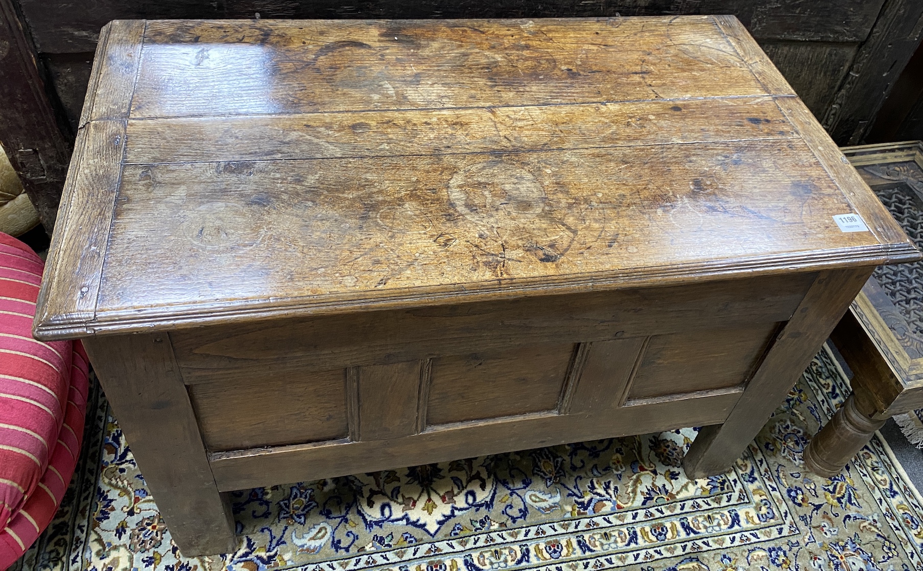 An early 18th century French oak coffer, with a triple panelled front, width 111cm, depth 62cm, height 69cm